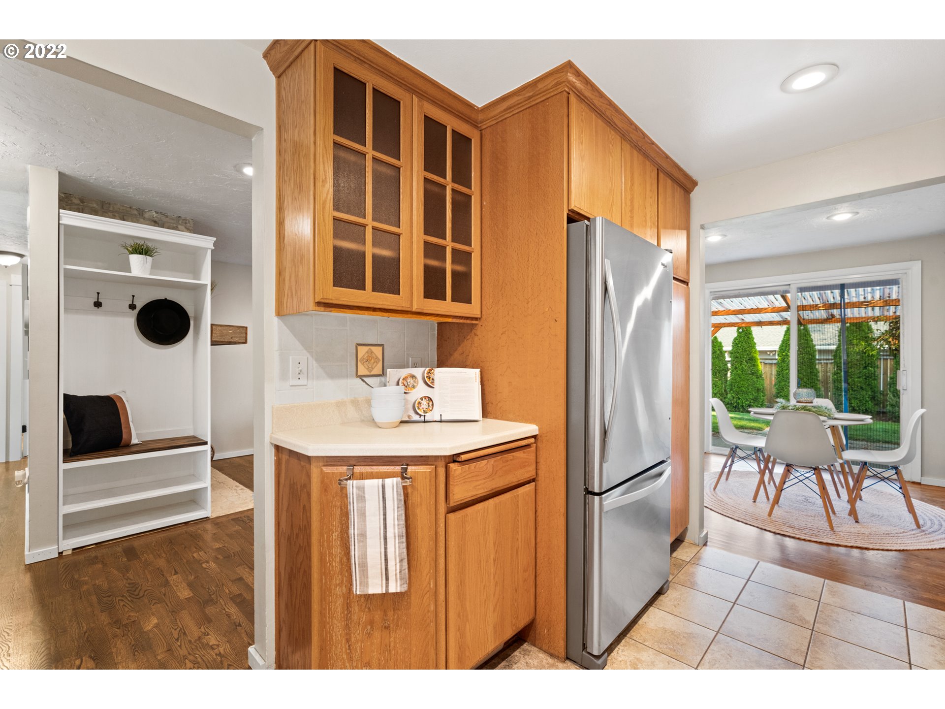 6920 Southwest Briarcliff Circle Beaverton, OR 97008 - Photo 14 of 32 a kitchen with stainless steel appliances kitchen island granite countertop a refrigerator and a sink