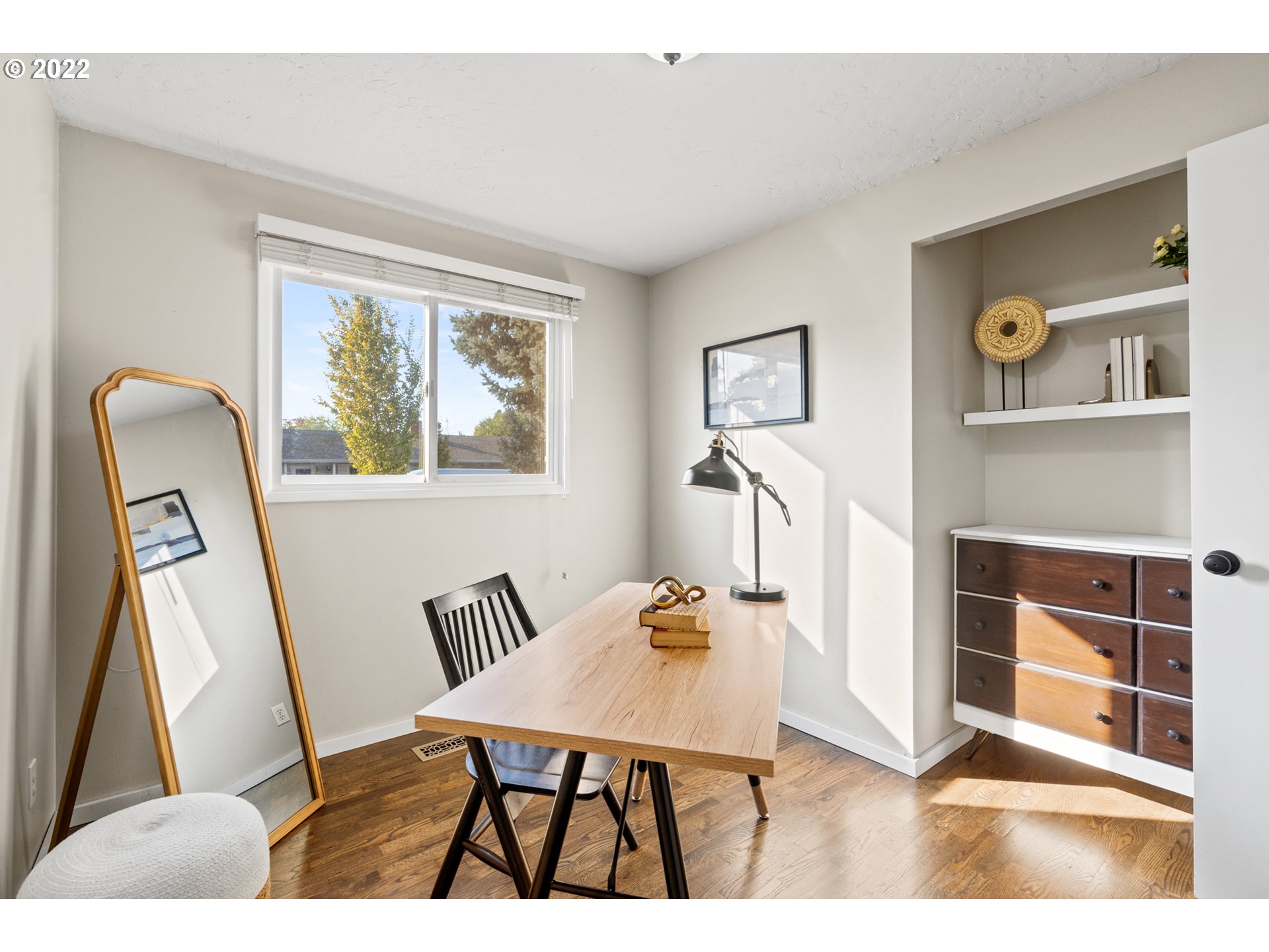 6920 Southwest Briarcliff Circle Beaverton, OR 97008 - Photo 18 of 32 a living room with furniture and a window