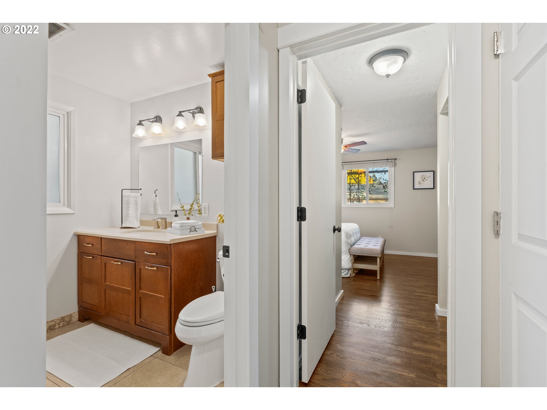 6920 Southwest Briarcliff Circle Beaverton, OR 97008 - Photo 20 of 32 a bathroom with a toilet a sink and mirror