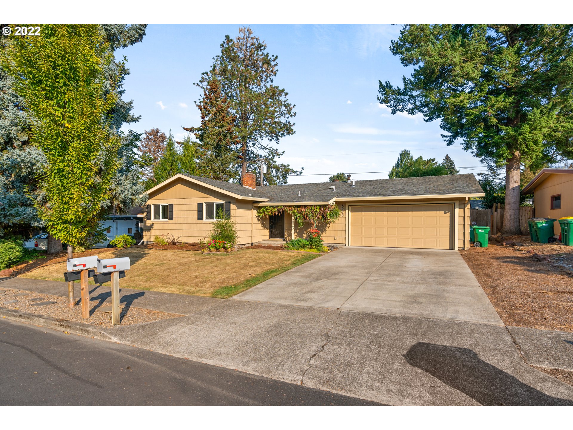 6920 Southwest Briarcliff Circle Beaverton, OR 97008 - Photo 2 of 32 a front view of a house with a yard