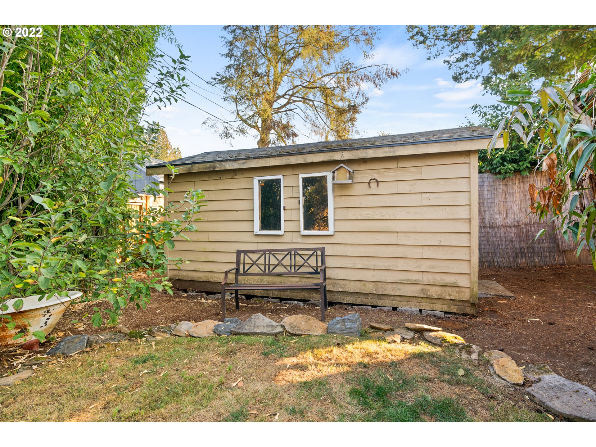 6920 Southwest Briarcliff Circle Beaverton, OR 97008 - Photo 28 of 32 a view of a house with a backyard
