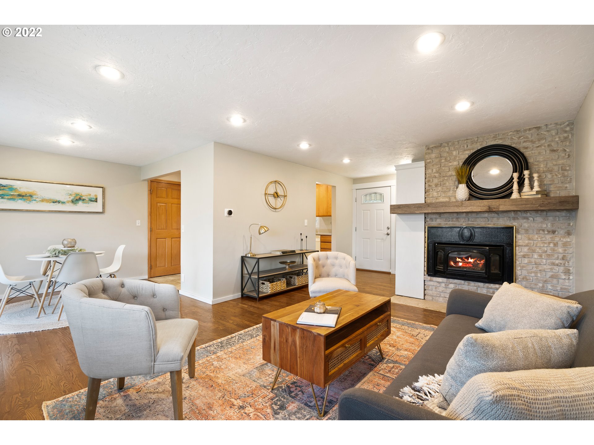 6920 Southwest Briarcliff Circle Beaverton, OR 97008 - Photo 4 of 32 a living room with furniture and a fireplace