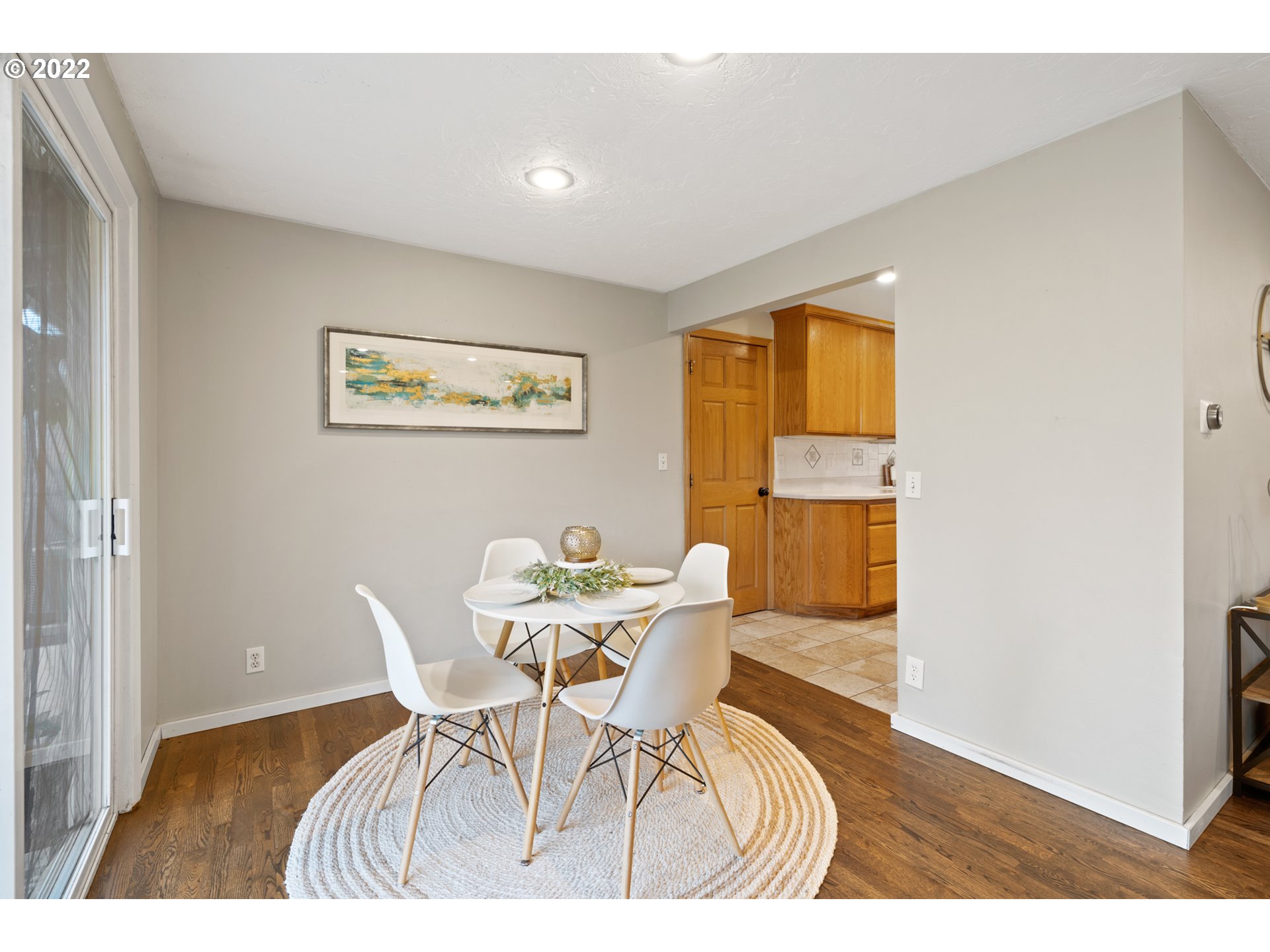6920 Southwest Briarcliff Circle Beaverton, OR 97008 - Photo 8 of 32 a view of a dining room with furniture and a window