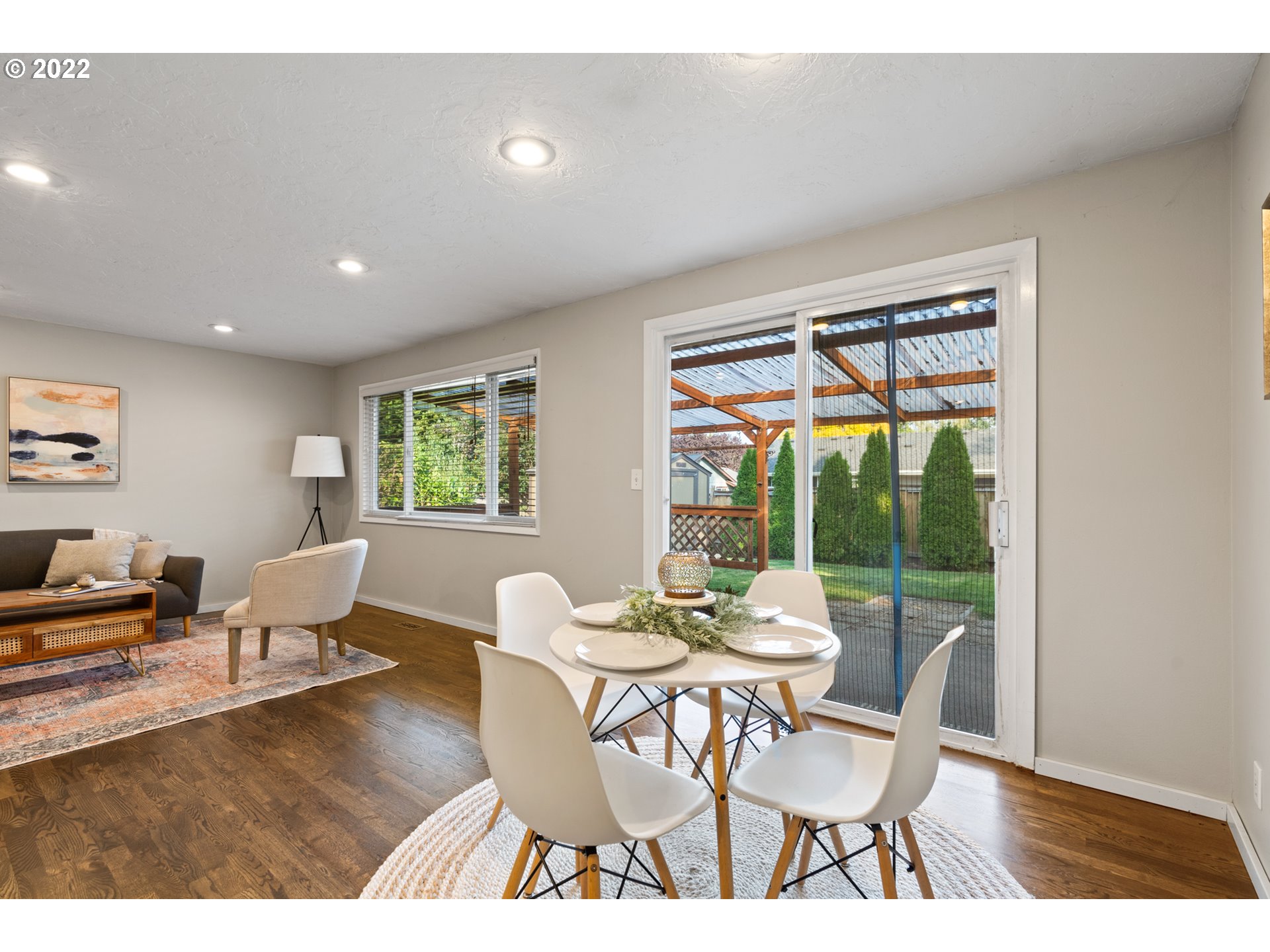 6920 Southwest Briarcliff Circle Beaverton, OR 97008 - Photo 10 of 32 a dining room with furniture and wooden floor
