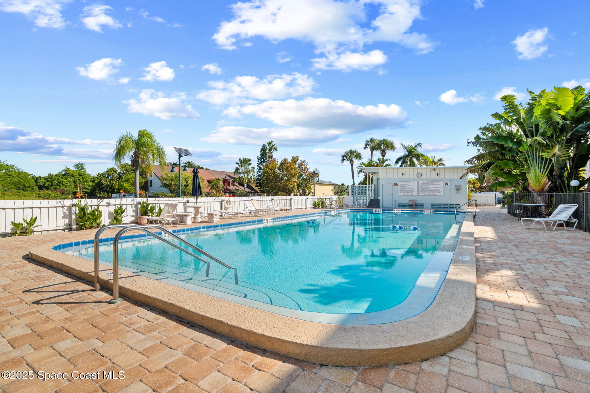 221 Columbia Drive, Unit 343 Cape Canaveral, FL 32920 - Photo 2 of 22 a view of a swimming pool with a porch