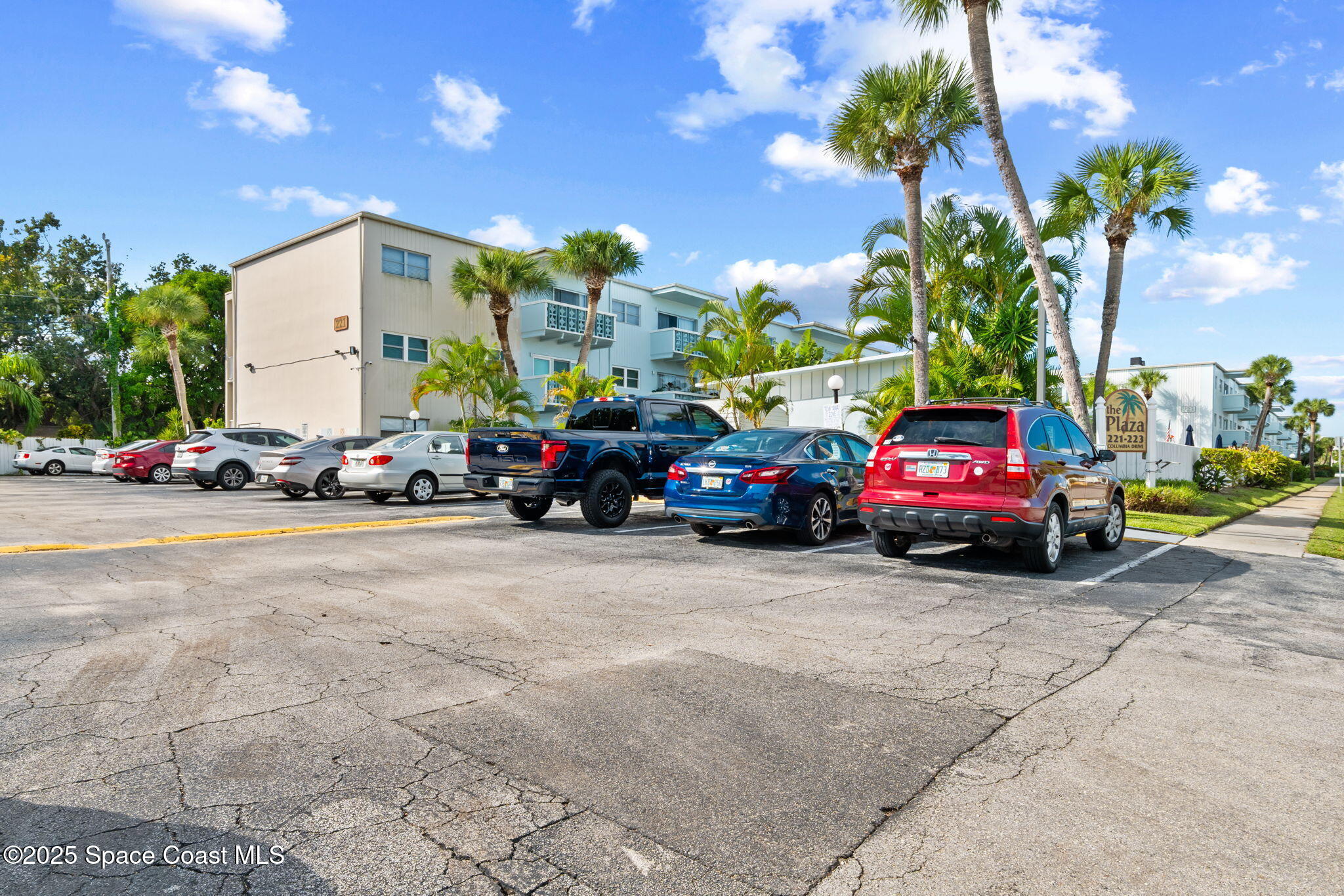 221 Columbia Drive, Unit 343 Cape Canaveral, FL 32920 - Photo 21 of 22 a view of a cars parked in front of a building