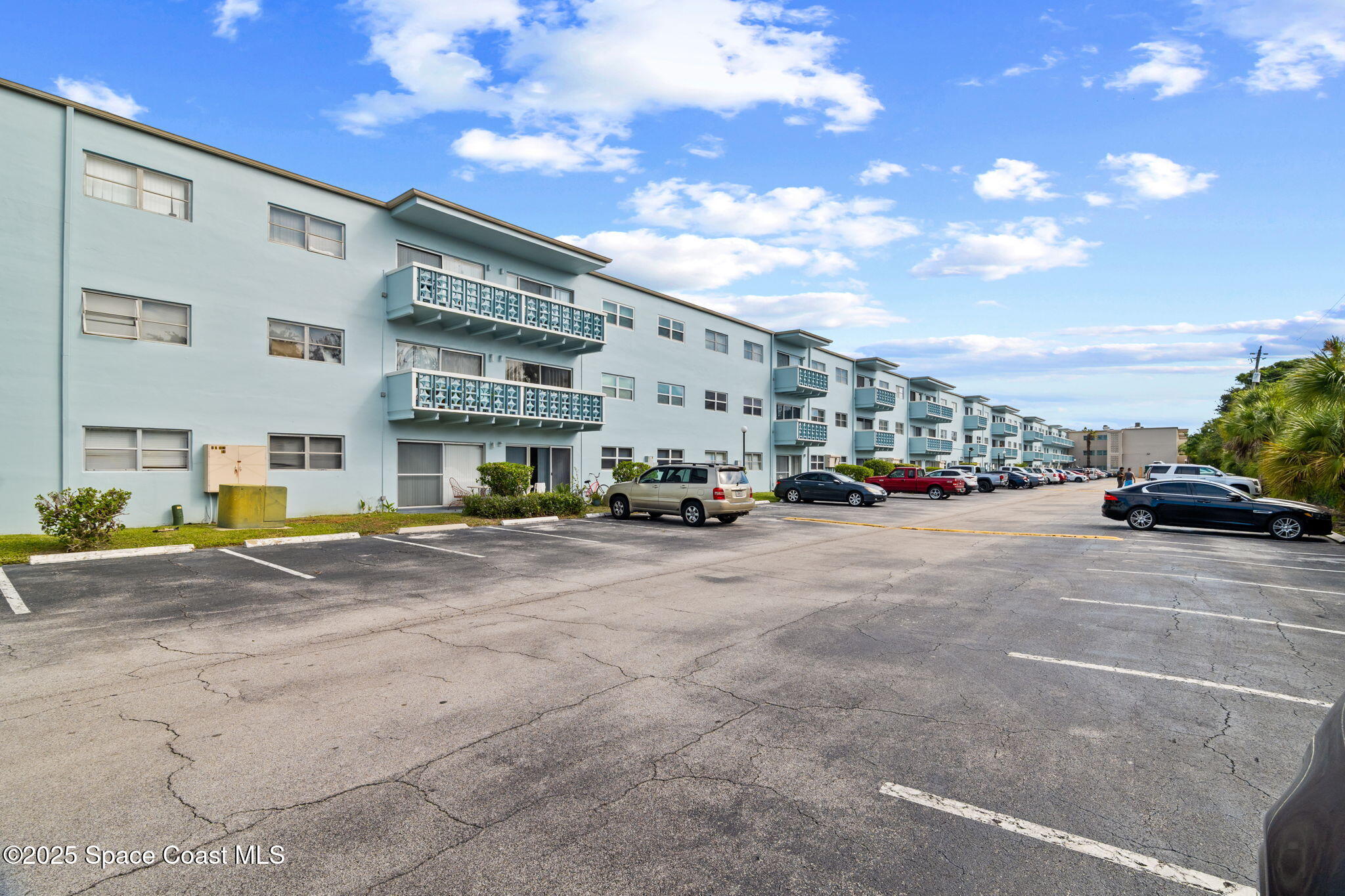 221 Columbia Drive, Unit 343 Cape Canaveral, FL 32920 - Photo 3 of 22 a view of a street with cars