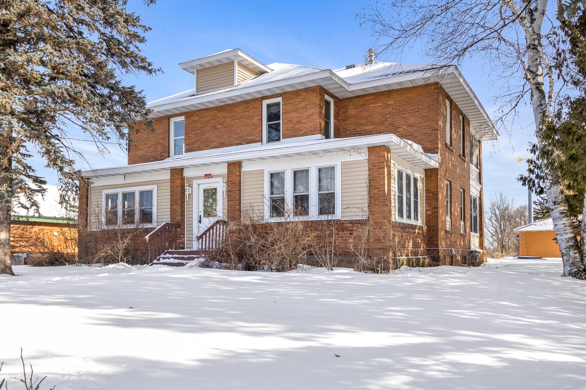 View of front of property with brick siding