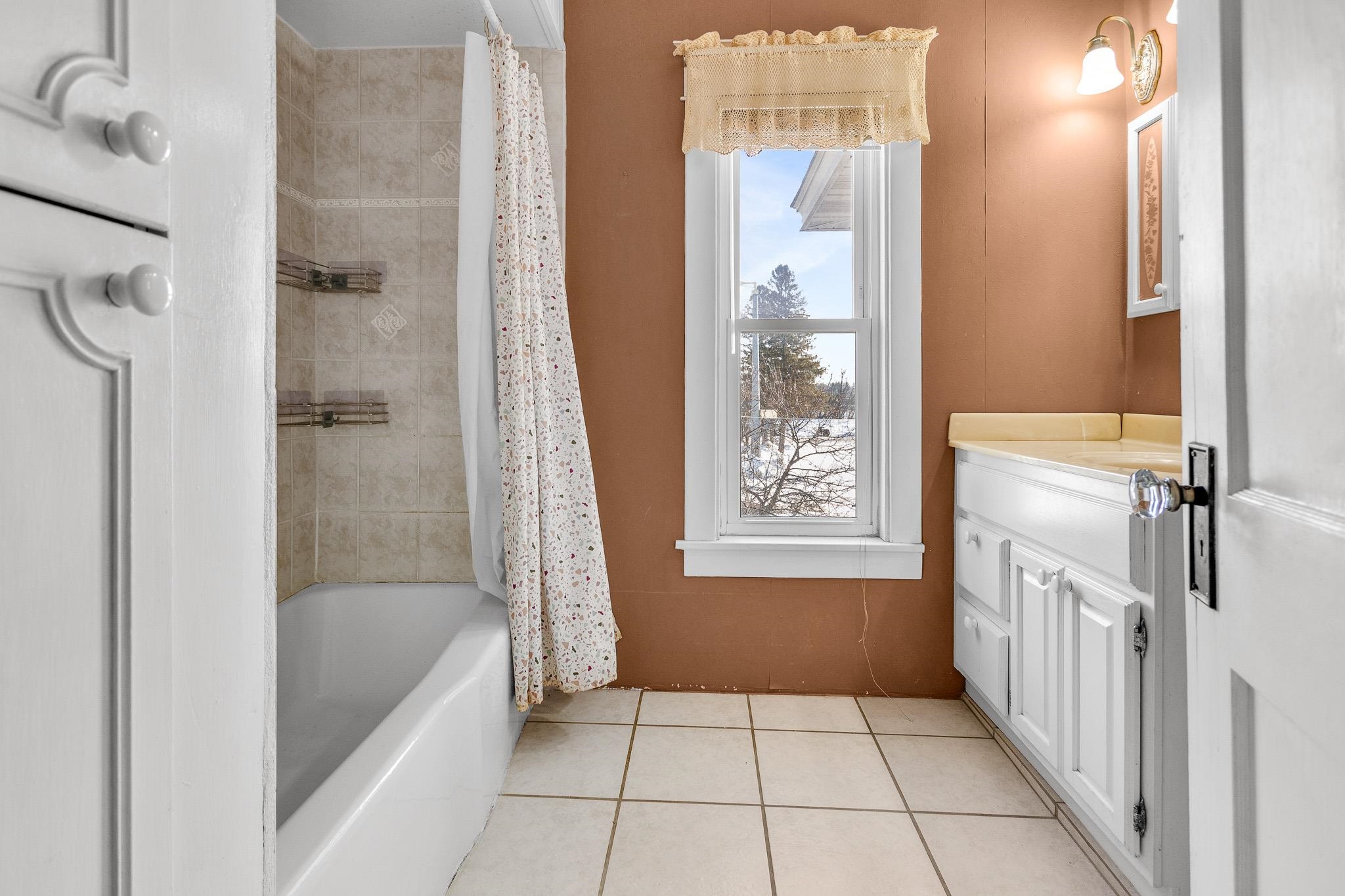 6494 School Street Finlayson, MN 55735 - Photo 26 of 32 Bathroom with vanity, shower / bath combination with curtain, and light tile patterned flooring