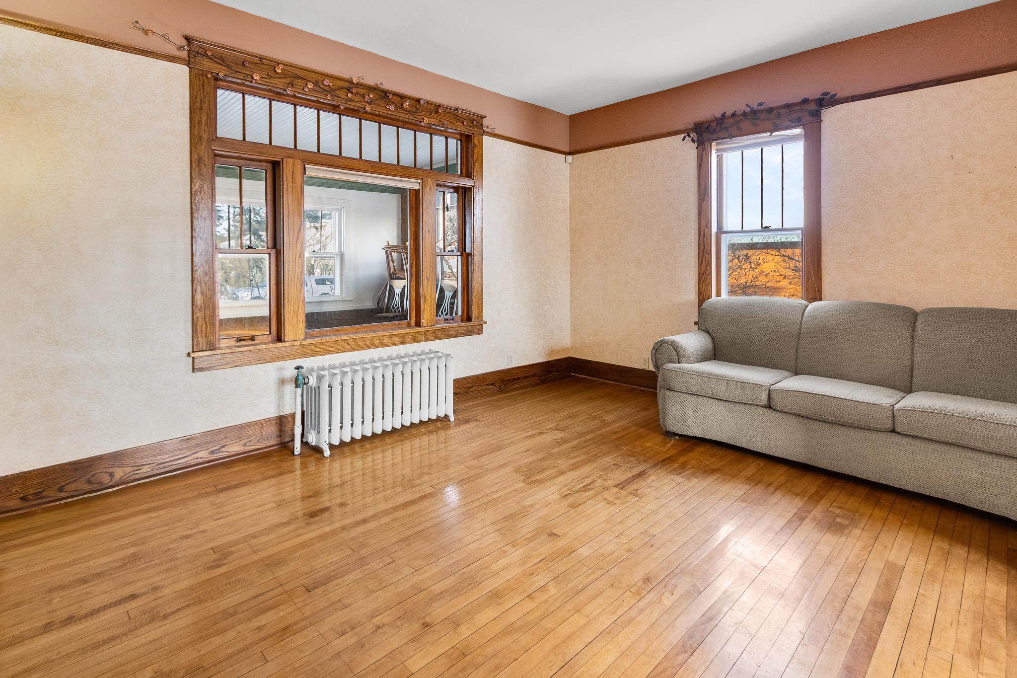 6494 School Street Finlayson, MN 55735 - Photo 10 of 32 Living room with radiator and hardwood / wood-style floors