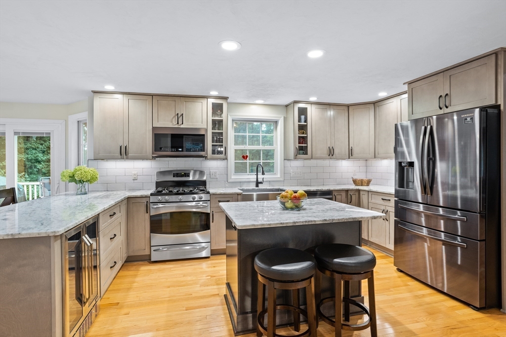 11 Little Turnpike Road Shirley, MA 01464 - Photo 4 of 36 a kitchen with a stove a sink and a refrigerator