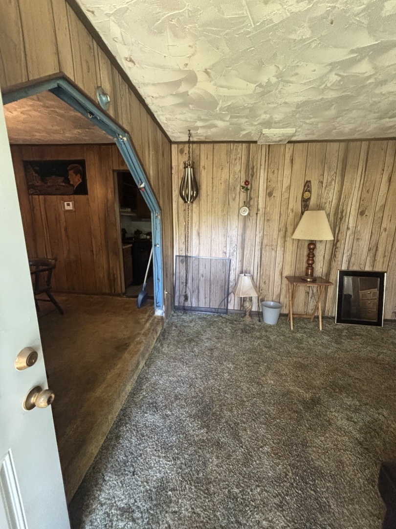 2458 South 12600E Road Pembroke Township, IL 60958 - Photo 8 of 16 a view of a room with wooden floor and chair