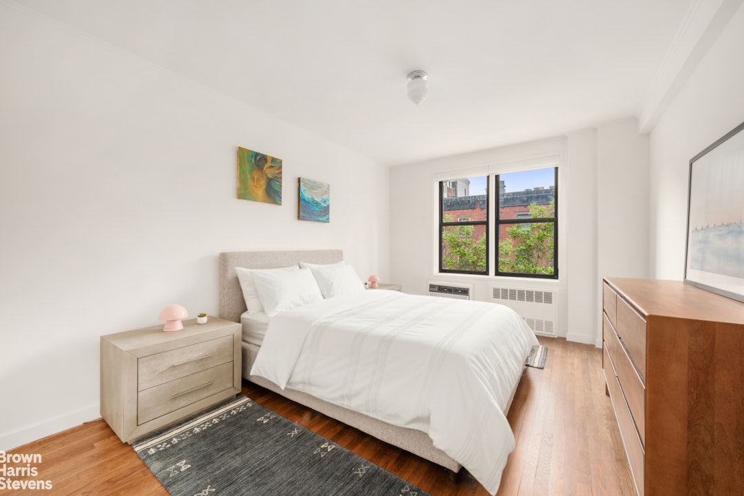 211 East 18th Street, Unit 3R Manhattan, NY 10003 - Photo 8 of 10 a spacious bedroom with a bed and a window
