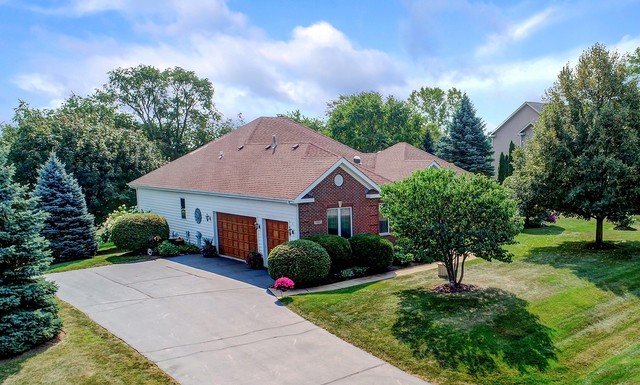 7202 Lone Oak Road Spring Grove, IL 60081 - Photo 3 of 59 a front view of a house with a yard and trees