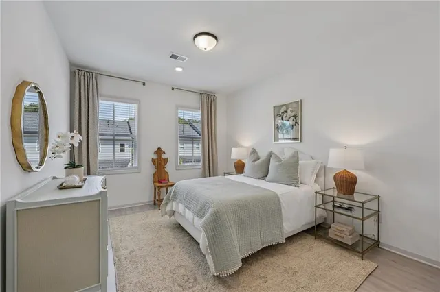 a room with stainless steel appliances kitchen island granite countertop furniture and a chandelier