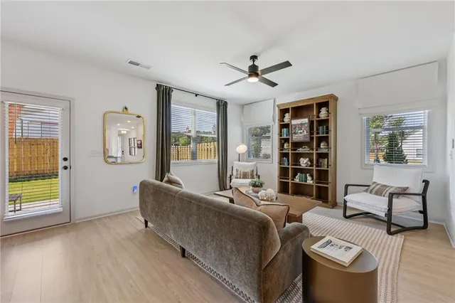 a living room with furniture and a table
