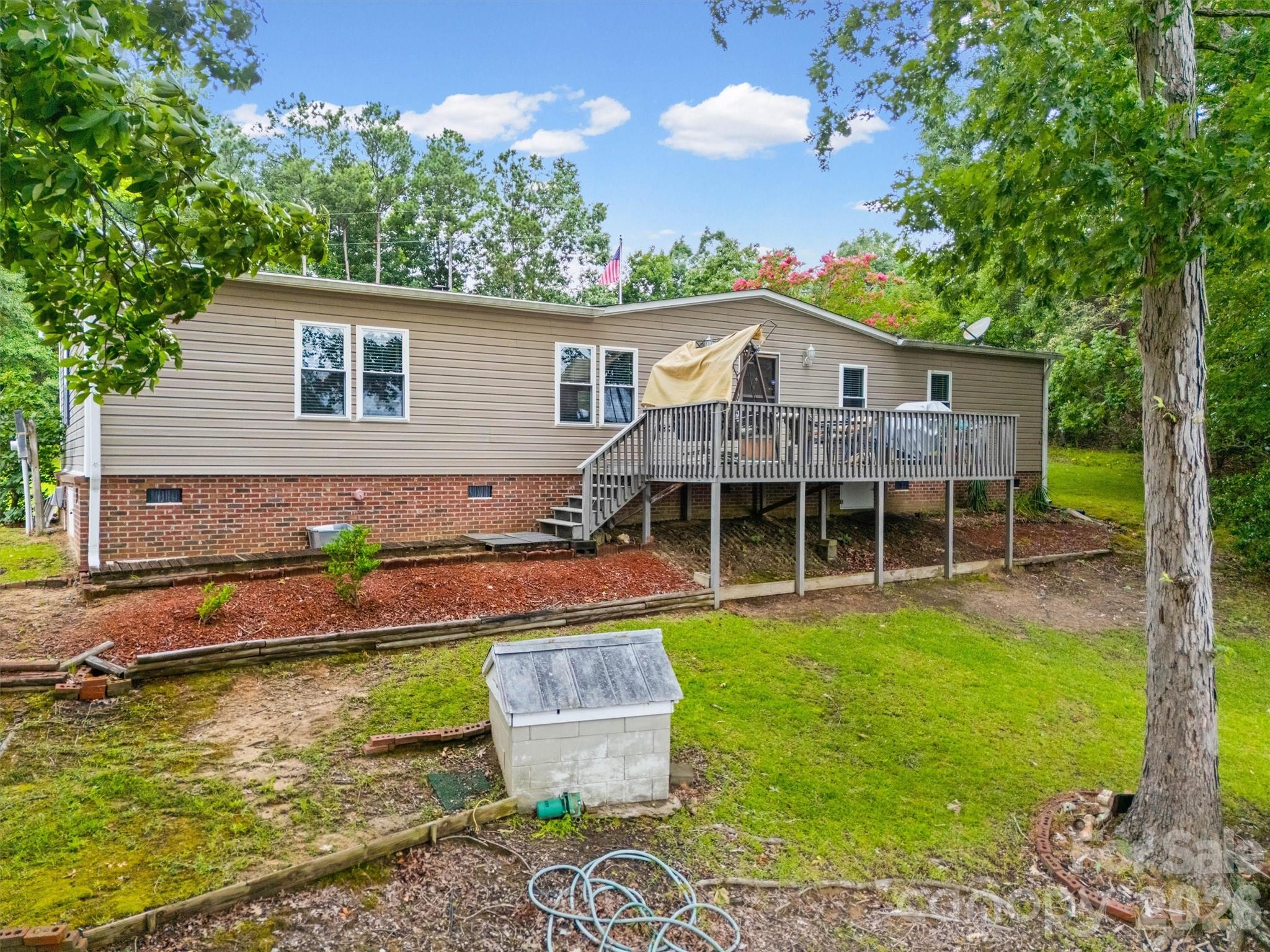 2071 Chameleon Road, Unit 156 York, SC 29745 - Photo 33 of 46 a view of a house with pool and a chairs