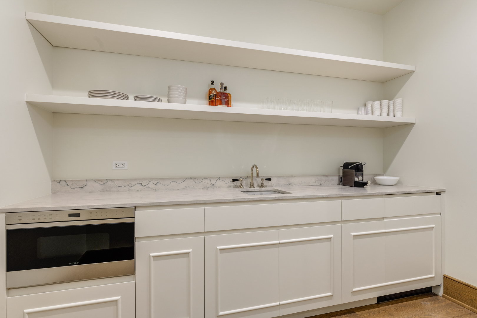 21 North May Street, Unit 902 Chicago, IL 60607 - Photo 11 of 26 a kitchen with a sink and cabinets