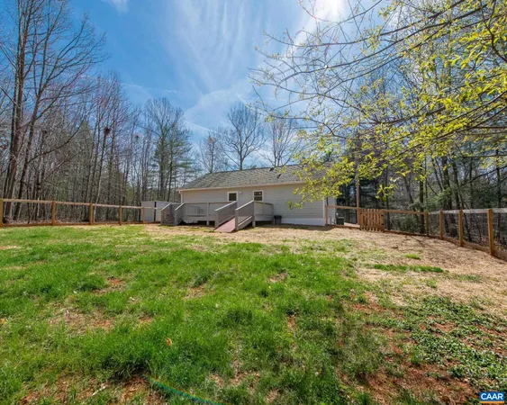 a view of a backyard with a small cabin