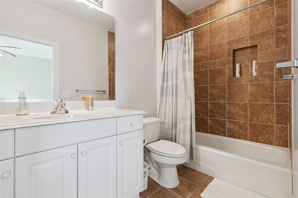 799 Oak Shadows Road Celebration, FL 34747 - Photo 39 of 97 a bathroom with a sink toilet and shower