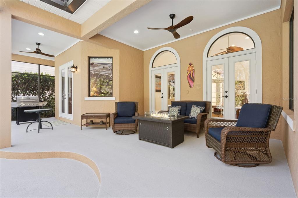 799 Oak Shadows Road Celebration, FL 34747 - Photo 42 of 97 a living room with furniture two large windows and wooden floor
