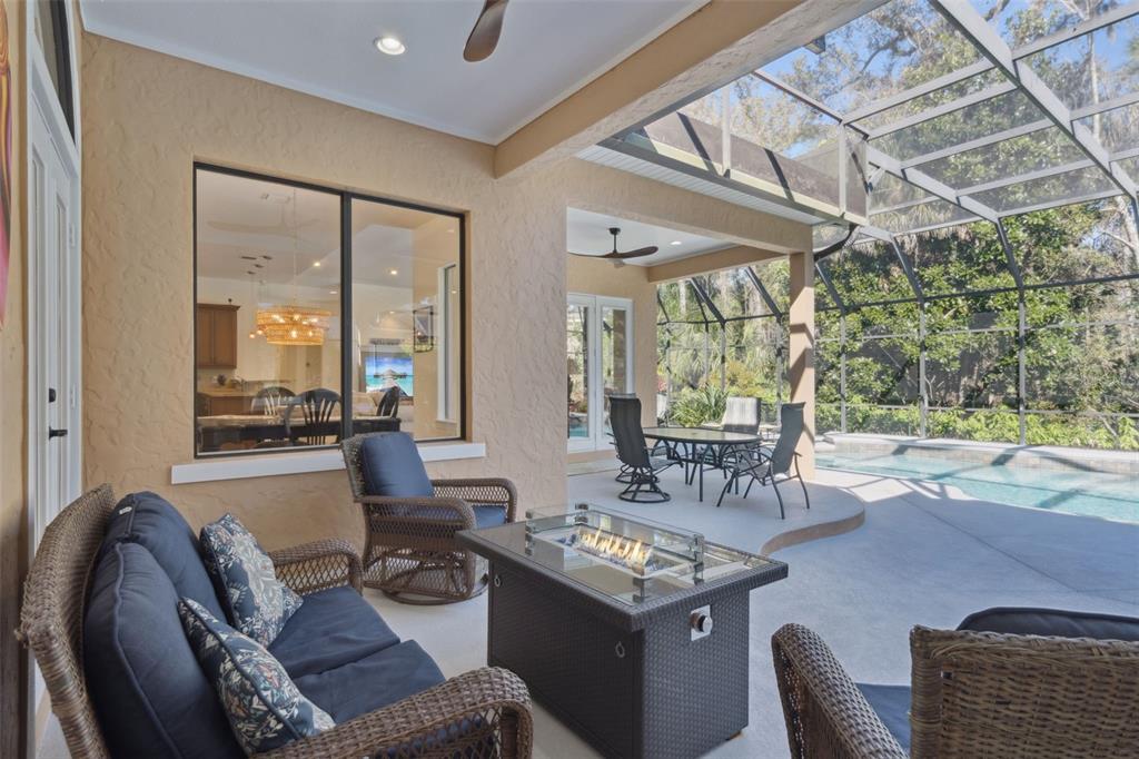 799 Oak Shadows Road Celebration, FL 34747 - Photo 43 of 97 a dining room with furniture and a large window