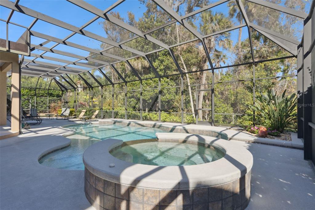 799 Oak Shadows Road Celebration, FL 34747 - Photo 47 of 97 a view of a patio with a table and chairs