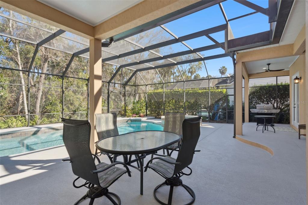 799 Oak Shadows Road Celebration, FL 34747 - Photo 49 of 97 a dining room with furniture and a window