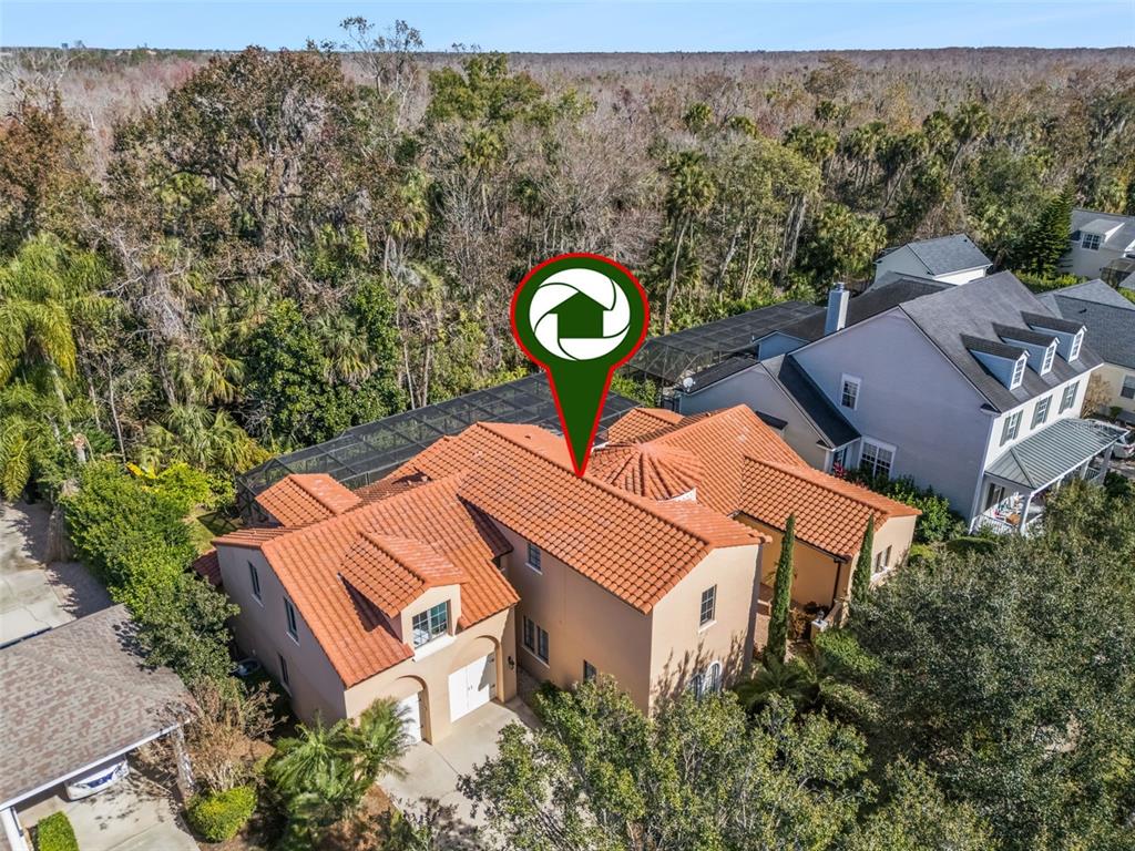 799 Oak Shadows Road Celebration, FL 34747 - Photo 56 of 97 an aerial view of a house with a yard and a large tree