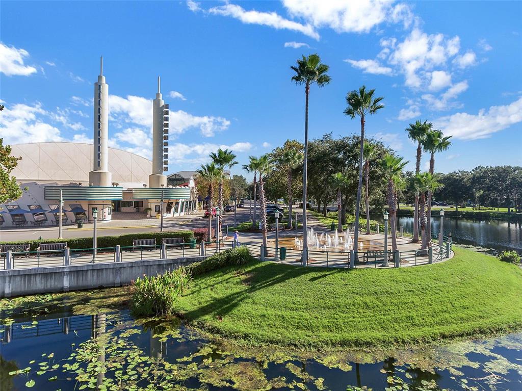 799 Oak Shadows Road Celebration, FL 34747 - Photo 73 of 97 a view of a lake with a big yard and palm trees