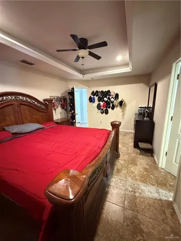 a bed room with a bed and a television