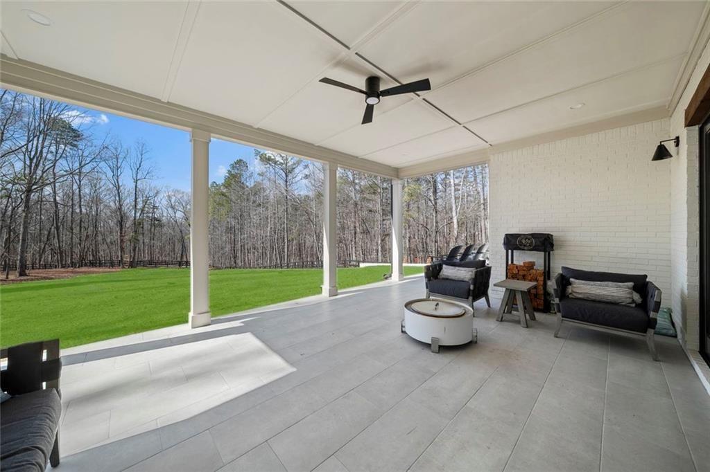 2309 Dinsmore Road Milton, GA 30004 - Photo 59 of 87 a living room with furniture and a yard