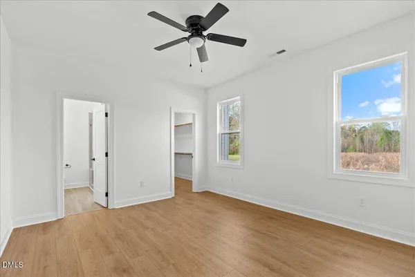 a view of an empty walk in closet
