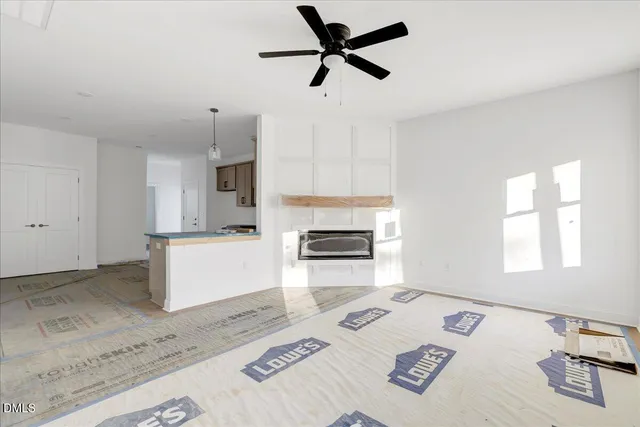 a kitchen with a stove a window and a fireplace