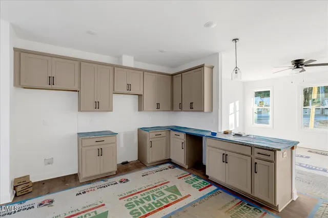 a kitchen that has a sink and a stove in it