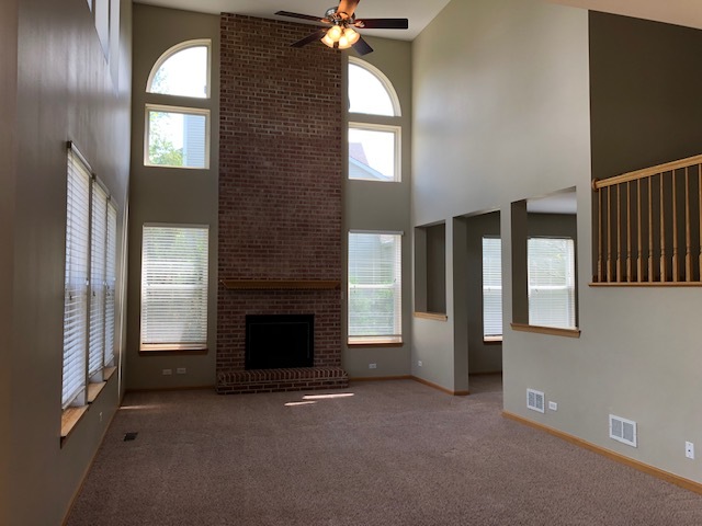 2845 Berman Road North Aurora, IL 60542 - Photo 2 of 23 an empty room with windows cabinet and fireplace