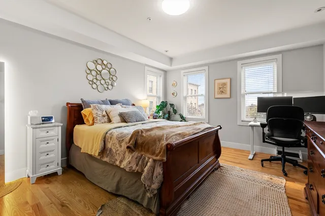 a bedroom with a bed and chair