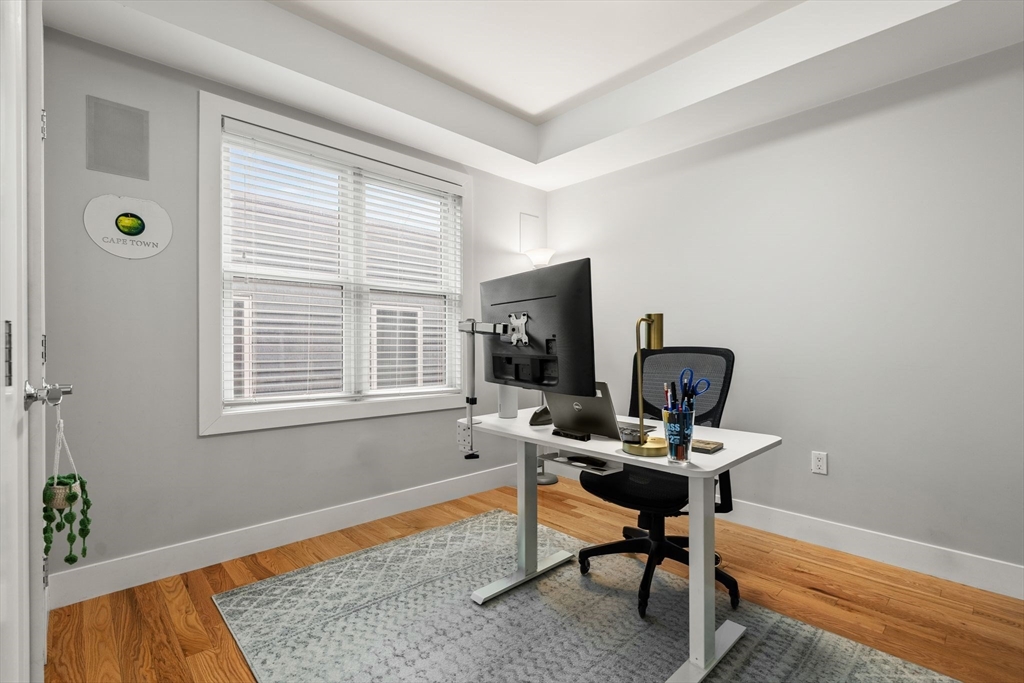 339 West Broadway, Unit 12 Boston, MA 02127 - Photo 18 of 23 a view of a workspace with furniture and a window