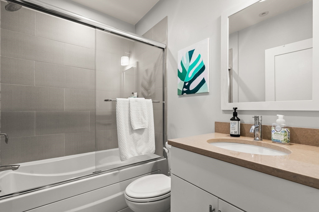 339 West Broadway, Unit 12 Boston, MA 02127 - Photo 19 of 23 a bathroom with a sink a toilet and shower