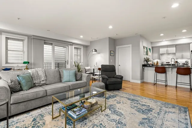 a living room with furniture and a table