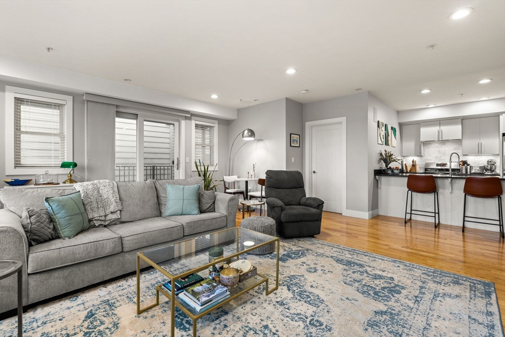339 West Broadway, Unit 12 Boston, MA 02127 - Photo 9 of 23 a living room with furniture and a table