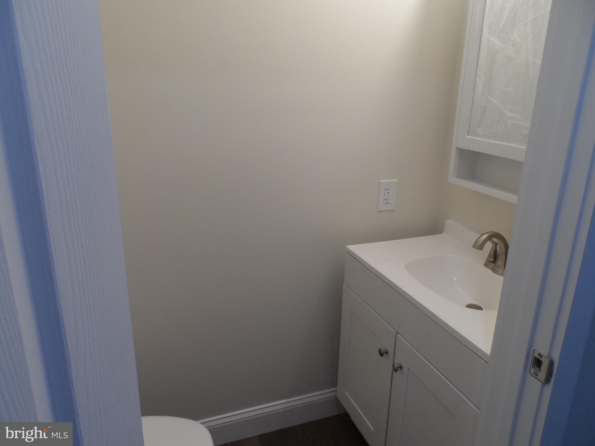 1335 Nottingham Way Hamilton, NJ 08609 - Photo 11 of 40 a bathroom with a sink and vanity