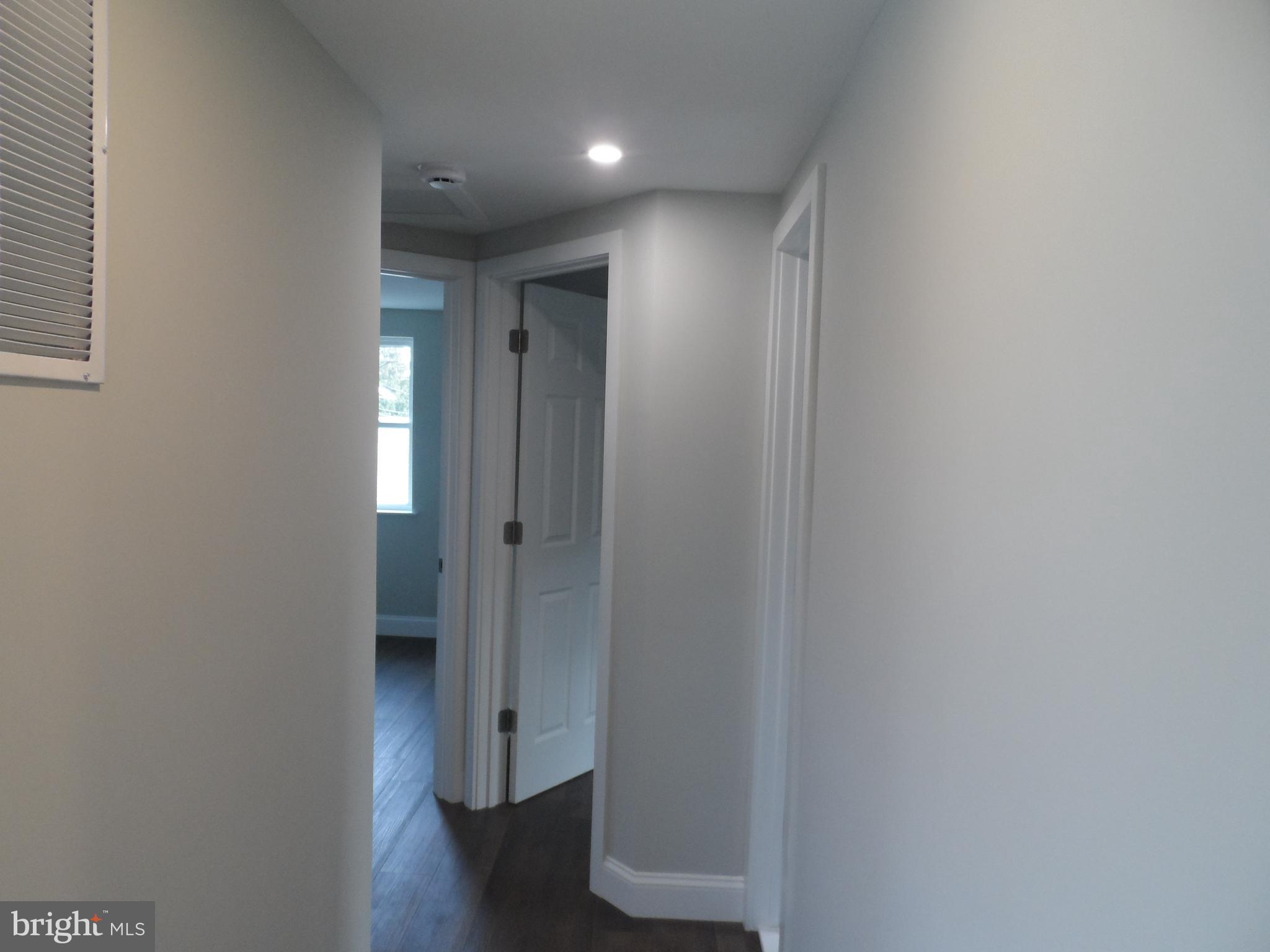 1335 Nottingham Way Hamilton, NJ 08609 - Photo 20 of 40 a view of a hallway with wooden floor