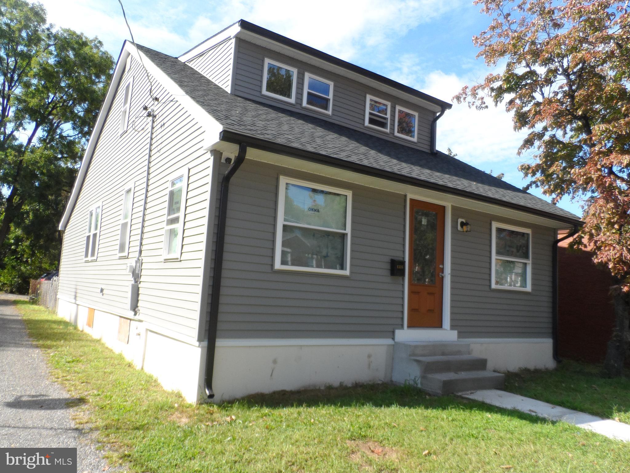 1335 Nottingham Way Hamilton, NJ 08609 - Photo 2 of 40 a front view of a house with a yard