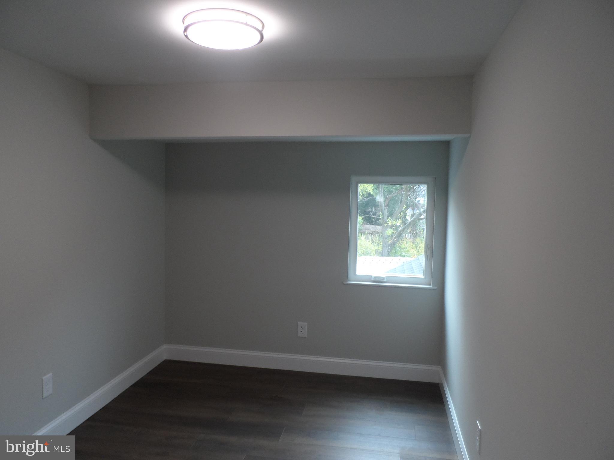 1335 Nottingham Way Hamilton, NJ 08609 - Photo 22 of 40 an empty room with a window