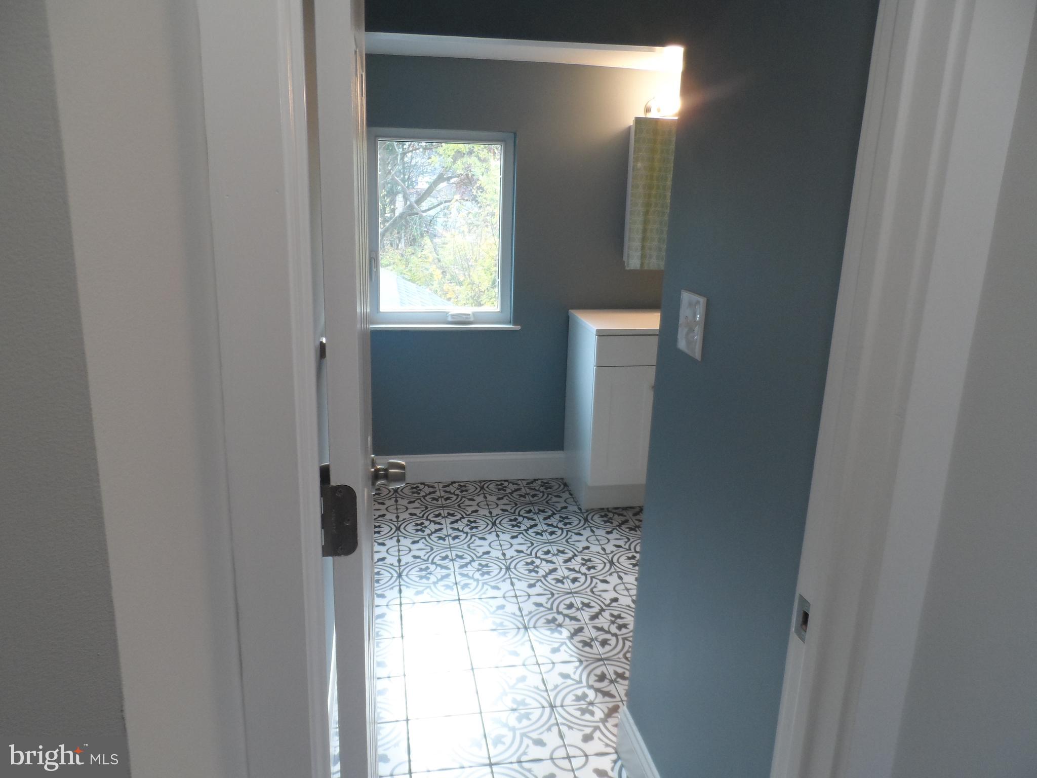 1335 Nottingham Way Hamilton, NJ 08609 - Photo 26 of 40 a bathroom with window and bathroom