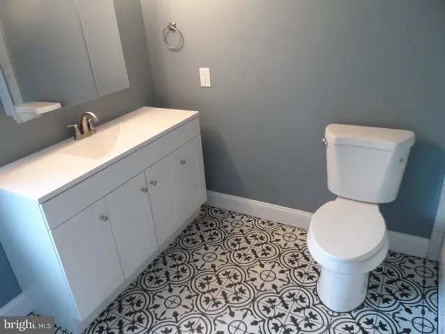 a bathroom with a toilet and a sink