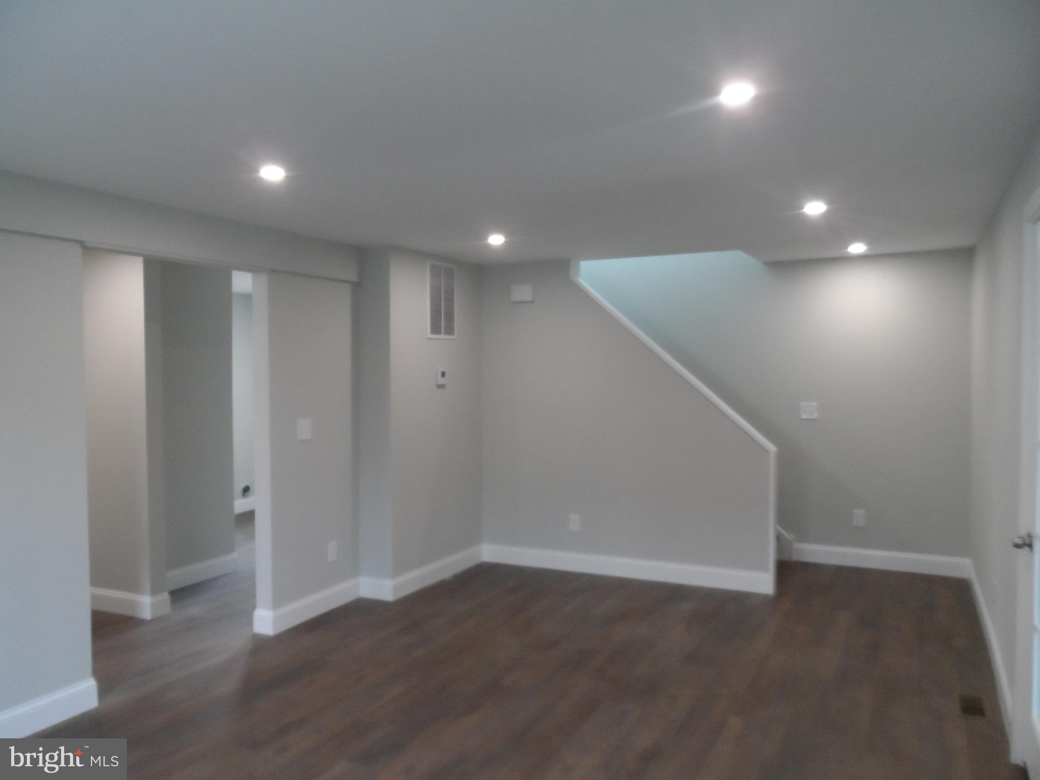 1335 Nottingham Way Hamilton, NJ 08609 - Photo 5 of 40 an empty room with wooden floor and windows