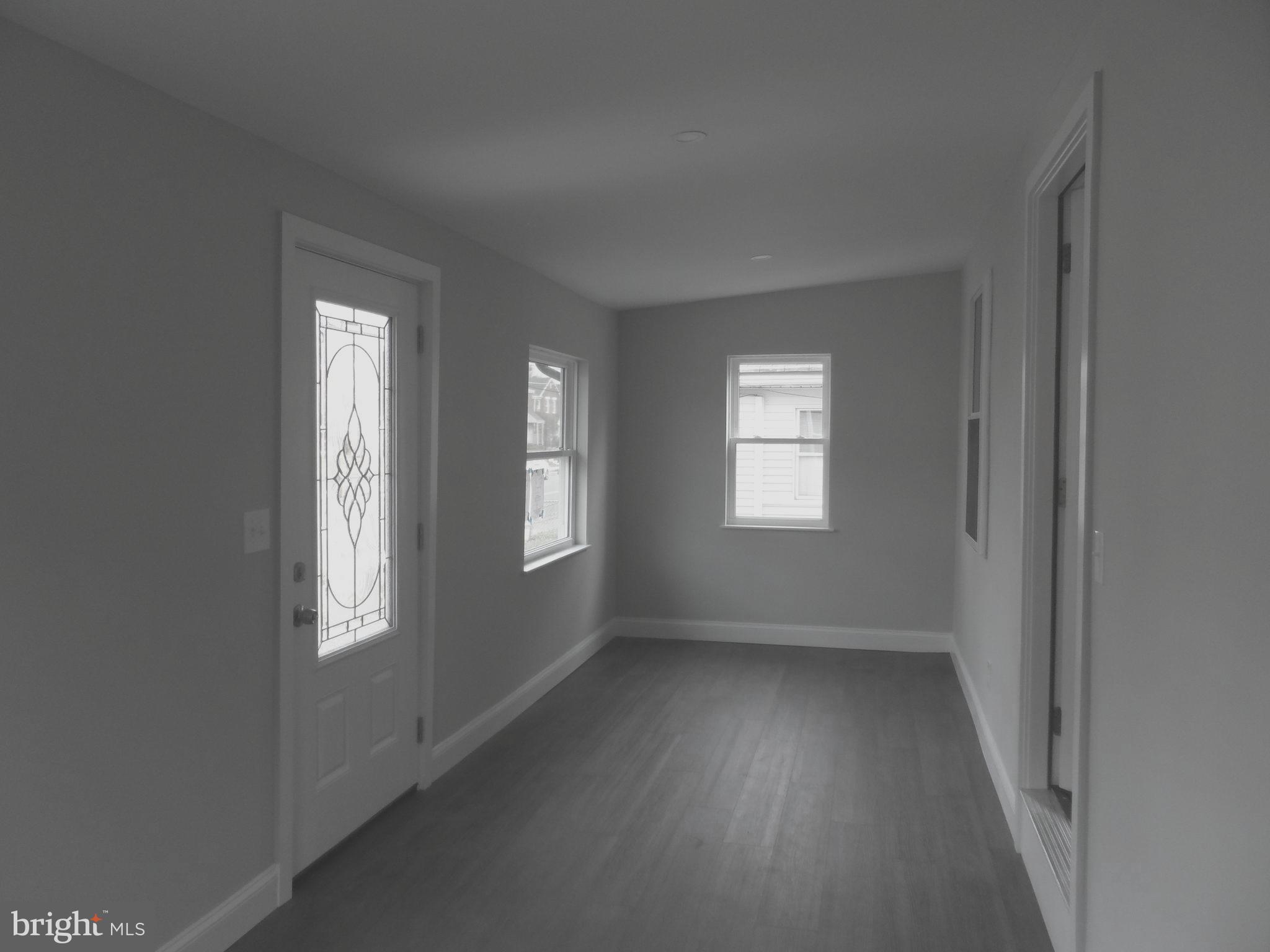 1335 Nottingham Way Hamilton, NJ 08609 - Photo 6 of 40 a view of an empty room with a window