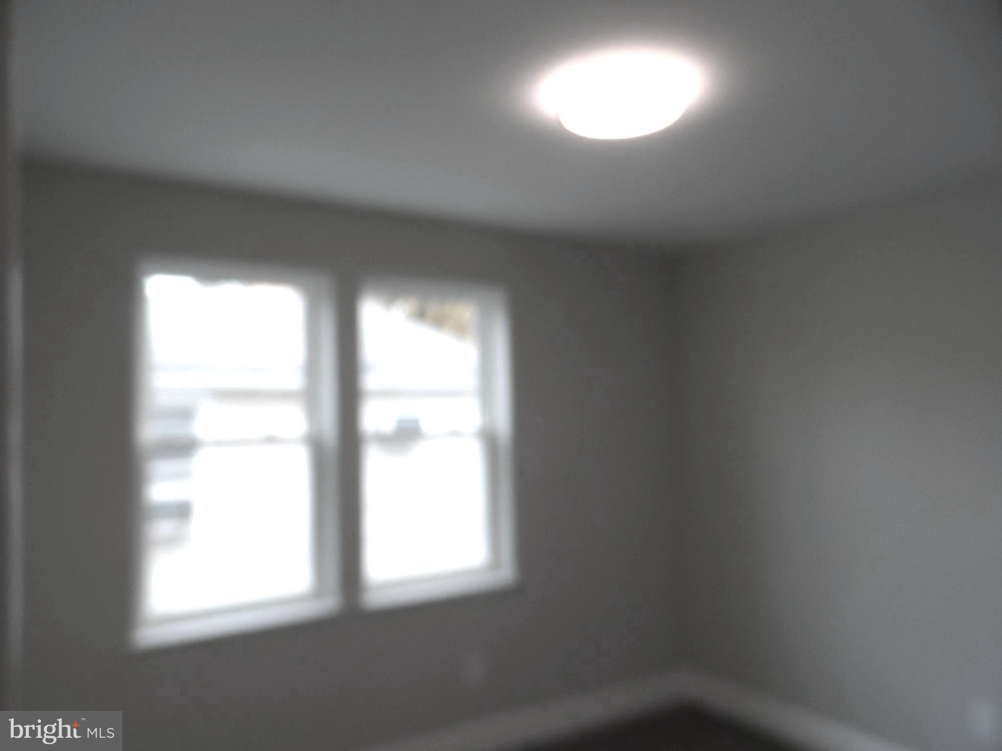 1335 Nottingham Way Hamilton, NJ 08609 - Photo 8 of 40 an empty room with a window